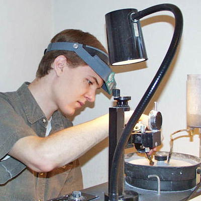 John Dyer faceting a gemstone