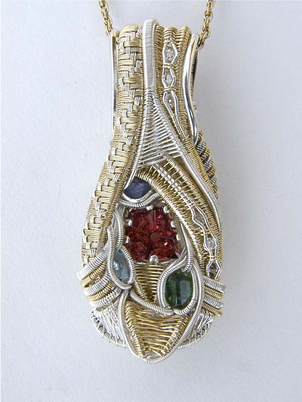 Wirewrap with Rhodolite Garnet Dreamscape™ cut in Gold and Silver