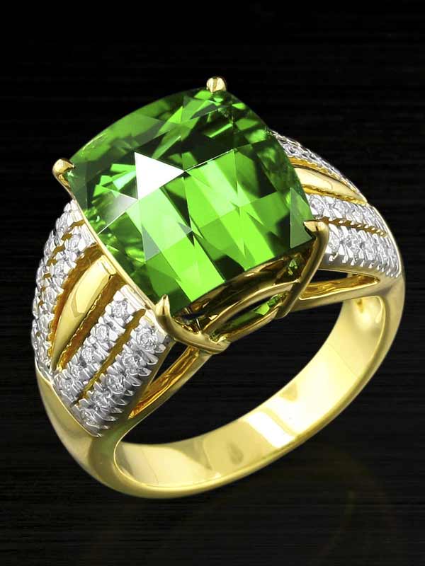 Custom cushion cut tourmaline in a designer gold and diamond ring