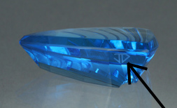 Blue Topaz cut by John Dyer showing the JD logo