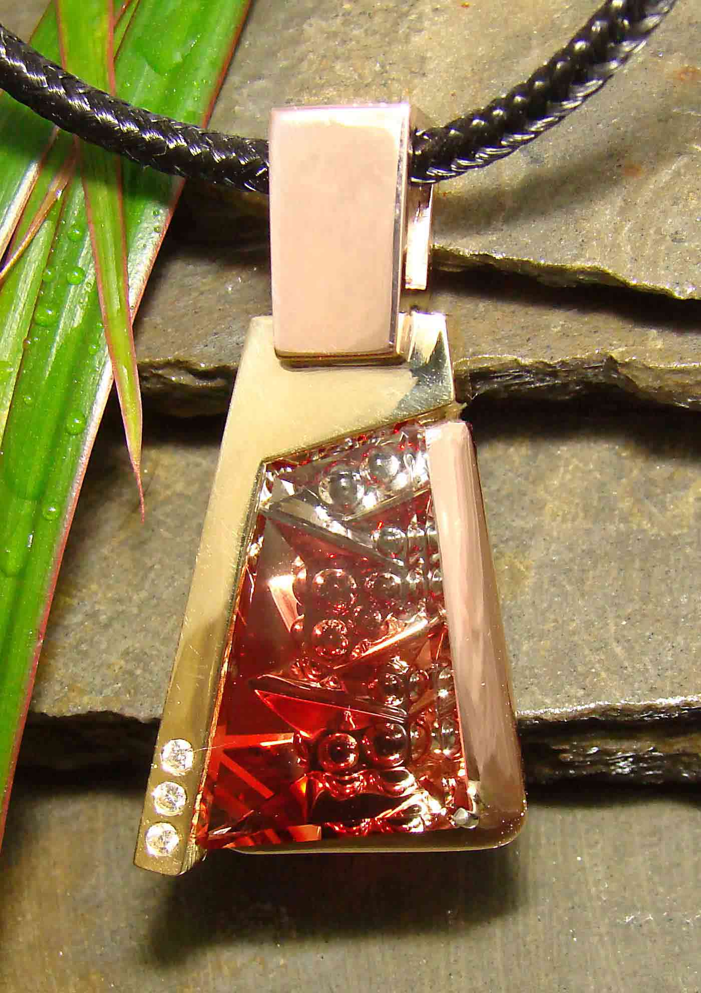 Fantasy Cut Sunstone from Oregon in a custom gold and diamond pendant designed by Peter Barr