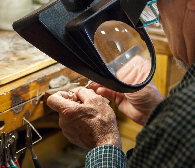 Goldsmith working on a ring at Midwest Jewelers and Estate Buyers