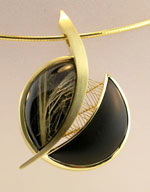 Rutilated quartz and gold pendant by R W Wise